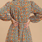 Collared neckline button down floral print dress with crochet trimmed details