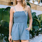 Smocked Bodice Washed Denim Romper Featuring Sleeveless