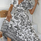 All-over positioning print printed puff-sleeved maxi-neck dress