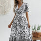 All-over positioning print printed puff-sleeved maxi-neck dress