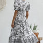 All-over positioning print printed puff-sleeved maxi-neck dress